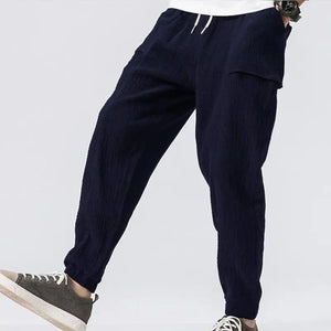 Sixtine Apparel | SOHO Modern Cargo Pants - navy blue. Model front view.