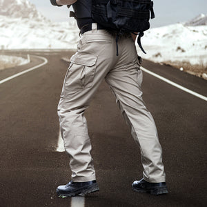 Weekend Explorer Cargo Pants - Sixtine Apparel - Model outdoors, offroad with mountain background.